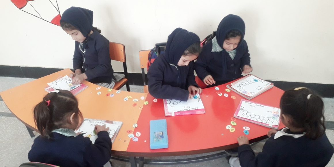 Junior Section: Nursery boys and girls busy with counting backward activity Junior Section: Nursery boys and girls busy with counting backward activity