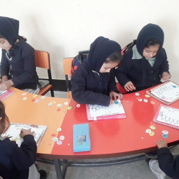 Junior Section: Nursery boys and girls busy with counting backward activity